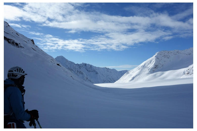 person observing the fieschergletscher glacier below the finsteraarhornhutte